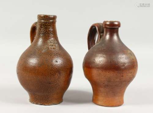 TWO SMALL BELLARMINE JUGS. 6.5ins and 6.75ins high.