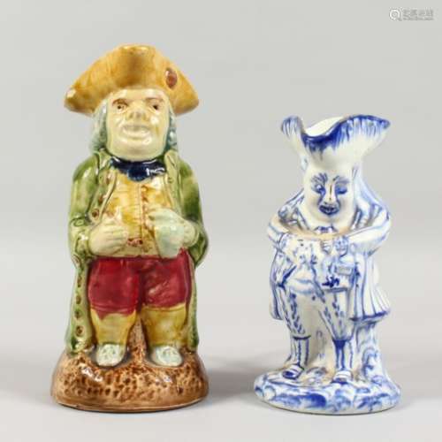 A TOBY JUG, with majolica glaze; together with blue and white Toby jug (2). 8.5ins and 7ins high.