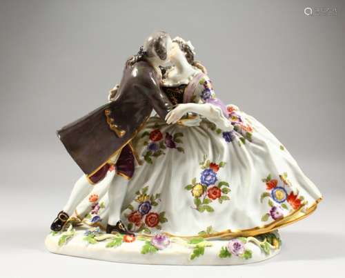 A GOOD LARGE MEISSEN FIGURE GROUP OF A GALLANT AND LADY, in a romantic embrace, the lady with a