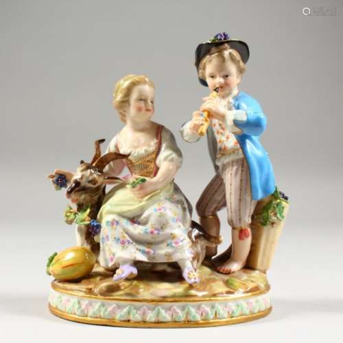 A GOOD SMALL MEISSEN GROUP OF A BOY AND GIRL, the boy standing playing a pipe, the girl seated by