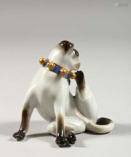 A SMALL MEISSEN FIGURE OF A SEATED DOG, his hind leg raised scratching his ear, crossed swords