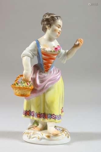 A SMALL MEISSEN FIGURE OF A GIRL, holding a basket of flowers in her right hand, crossed swords mark