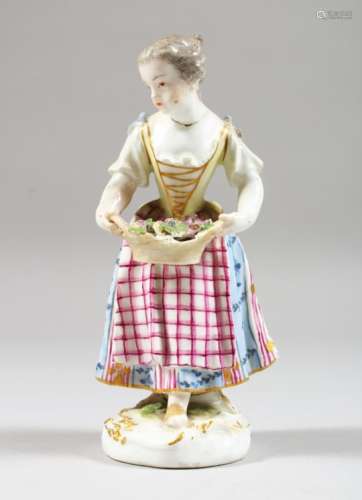 A SMALL MEISSEN FIGURE OF A GIRL, holding a basket of flowers in both hands. 5.25ins high.