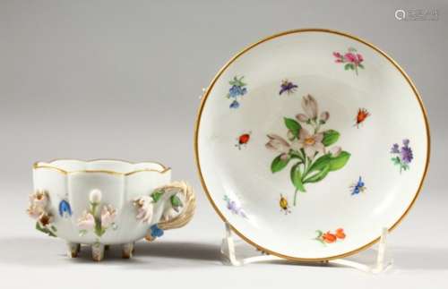 A MEISSEN CUP AND SAUCER, with floral encrusted decoration, painted with flowers, crossed swords