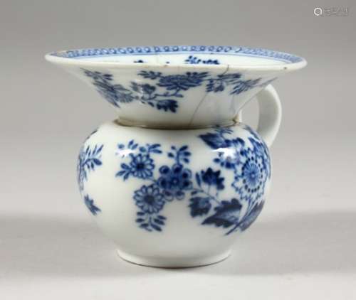 A MEISSEN SPITTOON, blue floral painted decoration with a scroll handle. crossed swords mark to