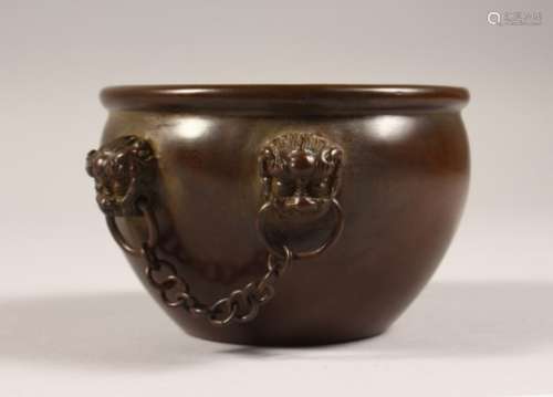A SMALL BRONZE CIRCULAR CENSER, with hanging chains. 4.25ins diameter.