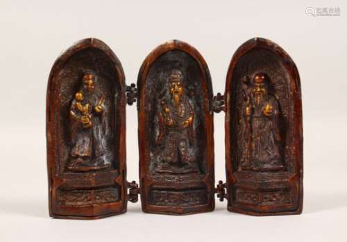 A BRONZE FOLDING TRYPTICH, containing three gods. 5.5ins high.