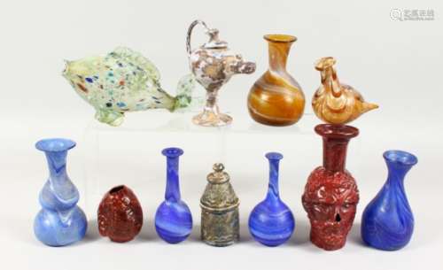 A GOOD COLLECTION OF ROMAN COLOURED GLASS BOTTLES AND JARS, including a model of a fish (11).