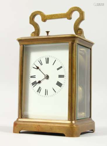 A GOOD FRENCH BRASS CARRIAGE CLOCK, with repeat movement, white enamel dial and Roman numerals. 5.