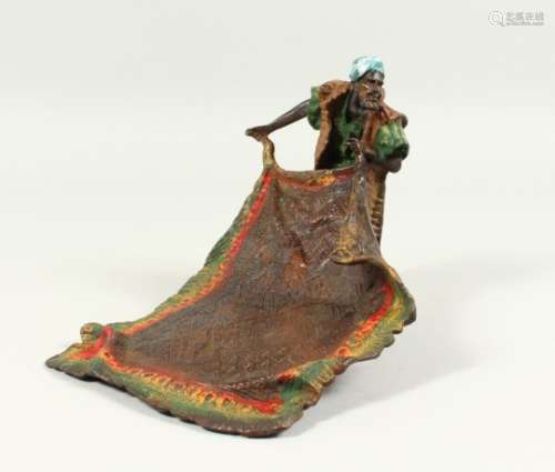A BERGMANN STYLE COLD PAINTED BRONZE OF A CARPET SELLER. 8ins long.