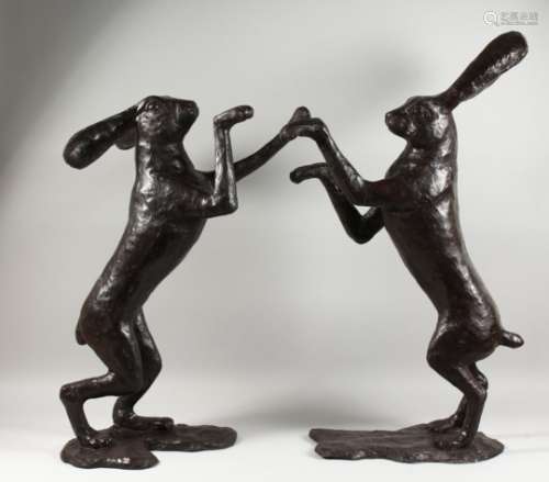 AN IMPRESSIVE LARGE PAIR OF BRONZE BOXING HARES. 35ins high.