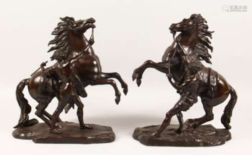 AFTER GUILLAUME COUSTOU A PAIR OF EARLY 20TH CENTURY MARLEY HORSES. 17ins high.