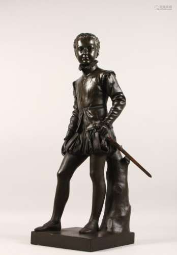 A PATINATED BRONZE FIGURE, LATE 19TH CENTURY, of a young male standing figure, his left hand on