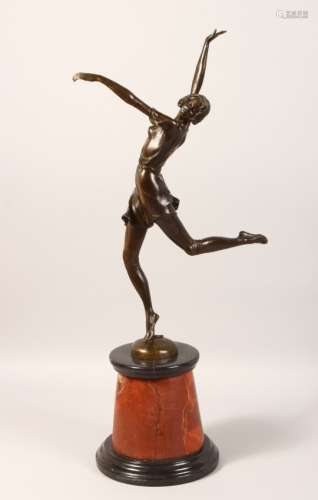 AN ART DECO STYLE BRONZE OF DANCING WOMEN, on a circular marble base. 25ins high.