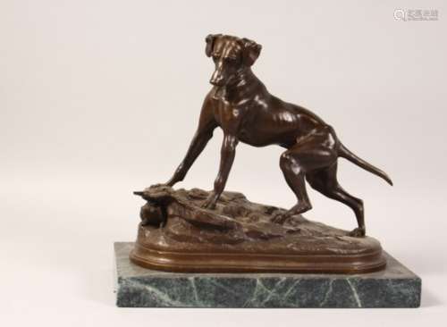AN AMUSING BRONZE OF A DOG CHASING A RABBIT DOWN A RABBIT HOLE, on a rectangular marble base. 11.