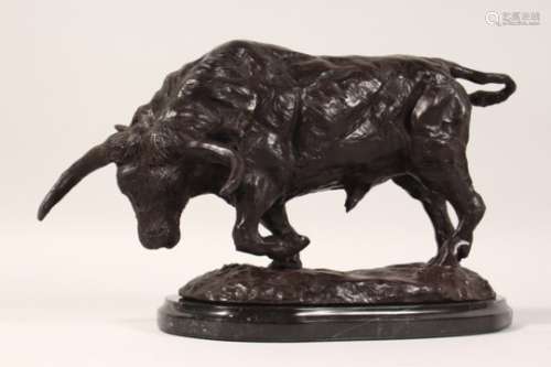 A NATURALISTIC BRONZE OF A STANDING BULL, on an oval marble base. 13ins long overall.