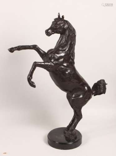 A BRONZE MODEL OF A REARING STALLION, on a circular marble base. 22ins high.