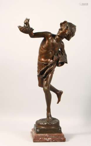 A GOOD BRONZE FIGURE, of a young boy holding a basket in his hand, on a stepped marble base. 24ins