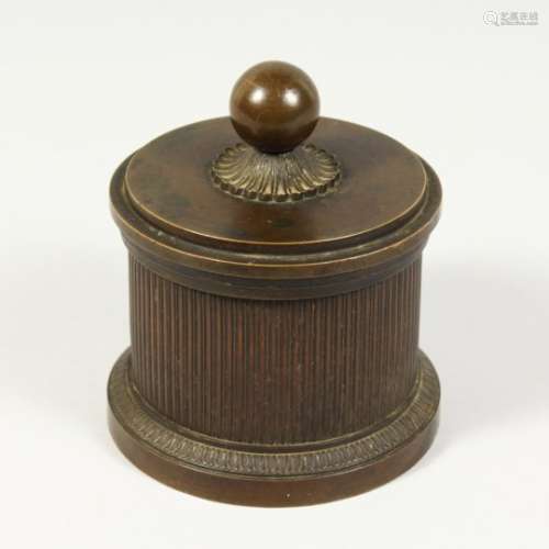 A 19TH CENTURY BRONZE CIRCULAR INKWELL AND COVER. 4ins diameter.