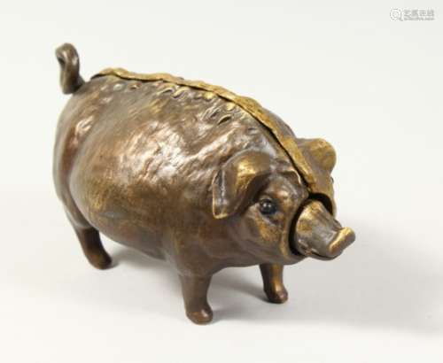 A BRONZE PIG SHAPE DESK BELL. 7ins long.