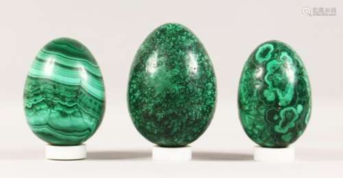 THREE LARGE MALACHITE EGGS. 7ins, 6.5ins and 6.25ins.