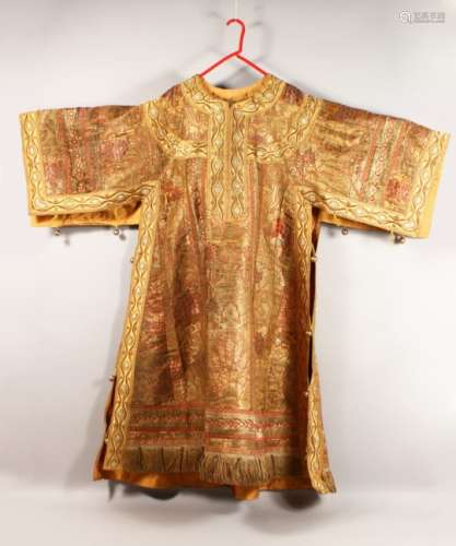 AN UNUSUAL EARLY 20TH CENTURY RUSSIAN COAT, with highly ornate gold thread embroidered decoration,
