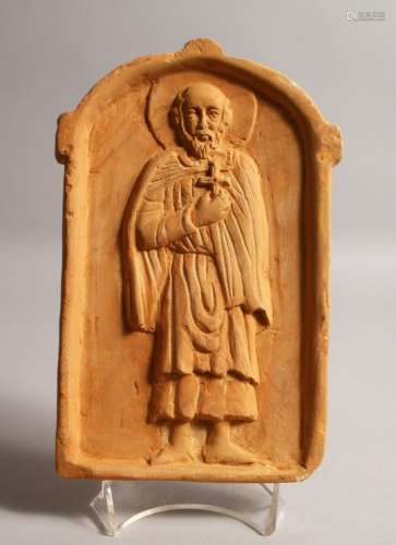 A SMALL MOULDED TERRACOTTA PLAQUE, depicting a male religious figure. 9ins high x 6ins wide.