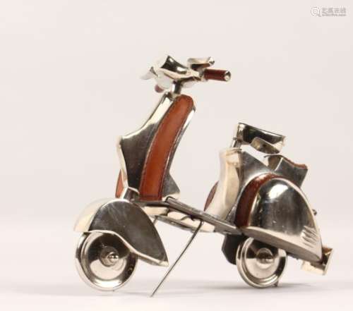 AN ALUMINIUM AND LEATHER MODEL OF A MOPED. 11ins long.