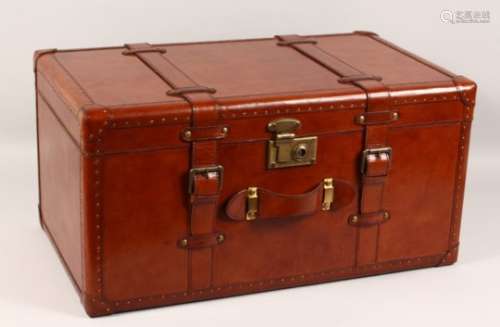 A GOOD LEATHER TRUNK. 24ins wide x 12ins high x 14ins deep.