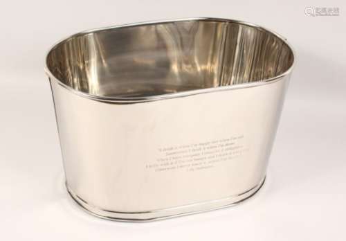 A SMALL OVAL POLISHED STEEL WINE COOLER. 17ins long.