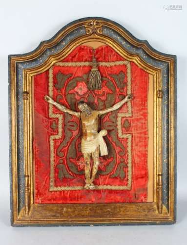 A VERY EARLY 16TH-17TH CENTURY CARVED WOOD AND PAINTED CORPUS CHRISTI, on a velvet background in a