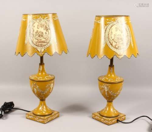 A PAIR OF YELLOW TOLEWARE STYLE URN SHAPED TABLE LAMPS AND SHADES. 21ins high.