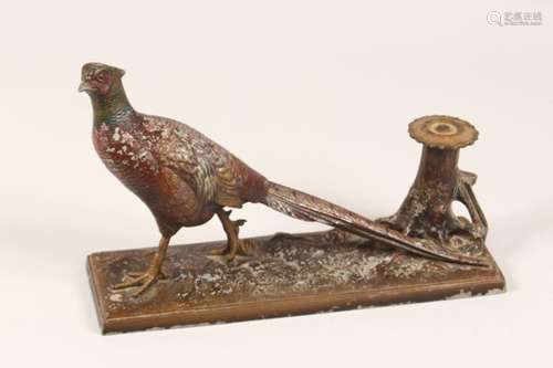 AN EARLY 20TH CENTURY PAINTED SPELTER TABLE LIGHTER, in the form of a pheasant by a tree stump.