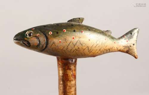 A WALKING STICK with carved and painted salmon handle. 50ins long.