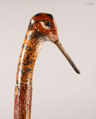 A WALKING STICK, with carved and painted pheasant head handle. 49ins long.