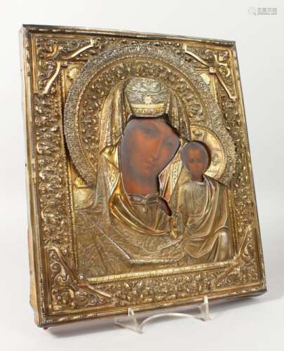 MADONNA AND CHILD, with silver cover. Maker: M.M. 12ins x 10.5ins.