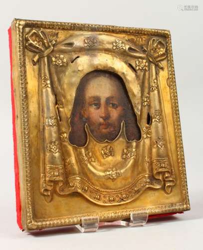 AN 18TH CENTURY RUSSIAN ICON, with silver gilt cover. 5.5ins x 5ins.