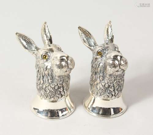 A GOOD PAIR OF HEAVY NOVELTY CAST SILVER RABBIT HEAD SALT AND PEPEPRS. 2.5ins high.