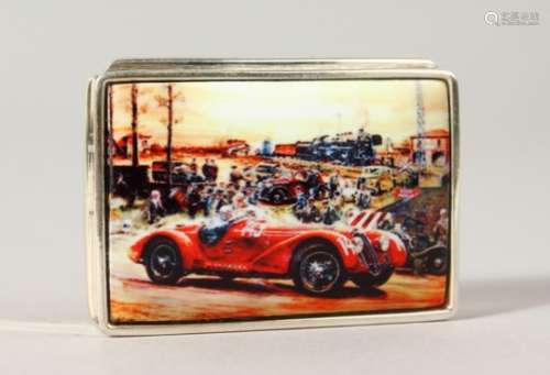 A SILVER PILL BOX, the lid with an enamel of a racing car.