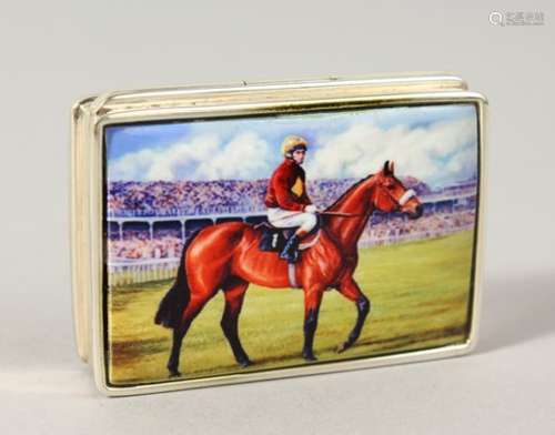 A SILVER PILL BOX, the lid with an enamel of a horse and jockey.