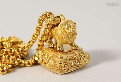 A GOLD PLATED LION SEAL ON A CHAIN.