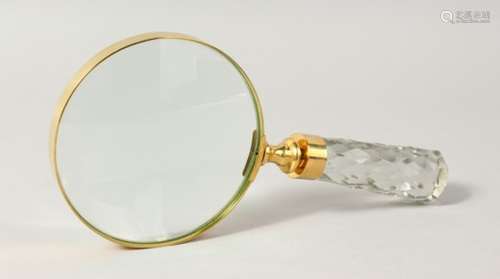 A MAGNIFYING GLASS with cut glass handle.