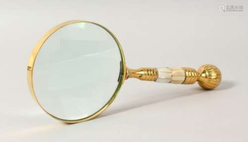 A MAGNIFYING GLASS with mother-of-pearl handle.