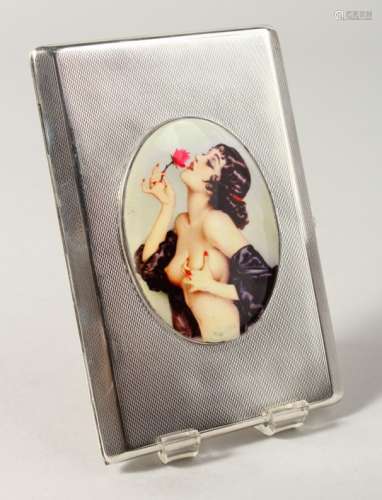 AN ENGINE TURNED SILVER CIGARETTE CASE, with oval nude smelling a rose. Birmingham 1954.