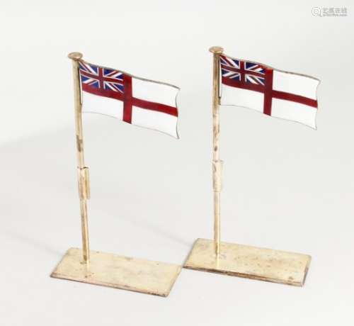 A PAIR OF SILVER PLATED AND ENAMEL PLACE NAME HOLDERS, modelled as white ensigns raised on