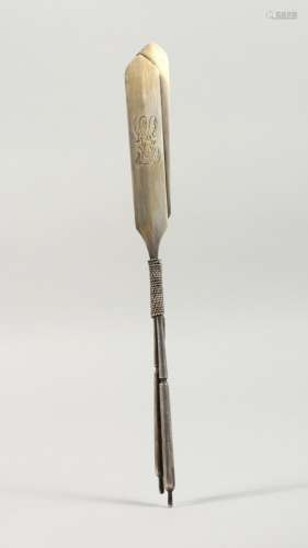 AN UNUSUAL RUSSIAN SILVER LETTER OPENER, modelled as a pair of oars, boxed. 9.5ins long.