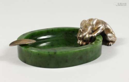 AN UNUSUAL RUSSIAN SILVER AND JADE ASHTRAY, modelled as a panther at a watering hole. 7.5ins wide.