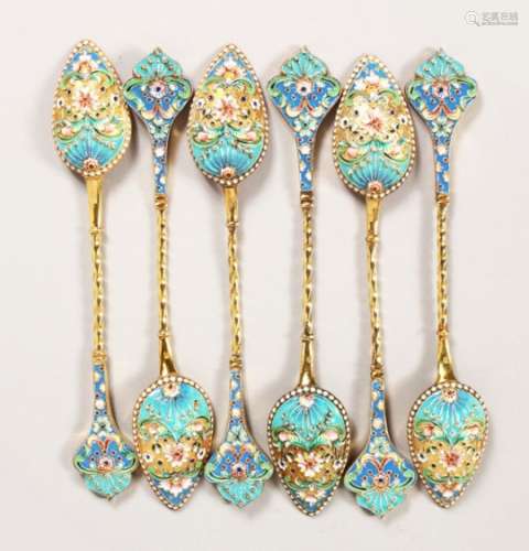 A SET OF SIX RUSSIAN SILVER AND ENAMEL TEASPOONS. 6ins long.