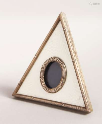A RUSSIAN SILVER AND WHITE GUILLOCHE ENAMEL TRIANGULAR SHAPE PHOTOGRAPH FRAME. 5ins high.