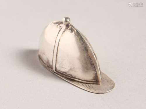 A SILVER JOCKEY CAP VESTA.